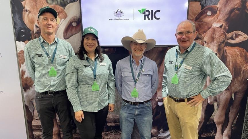 Four people dressed in RIC uniform.