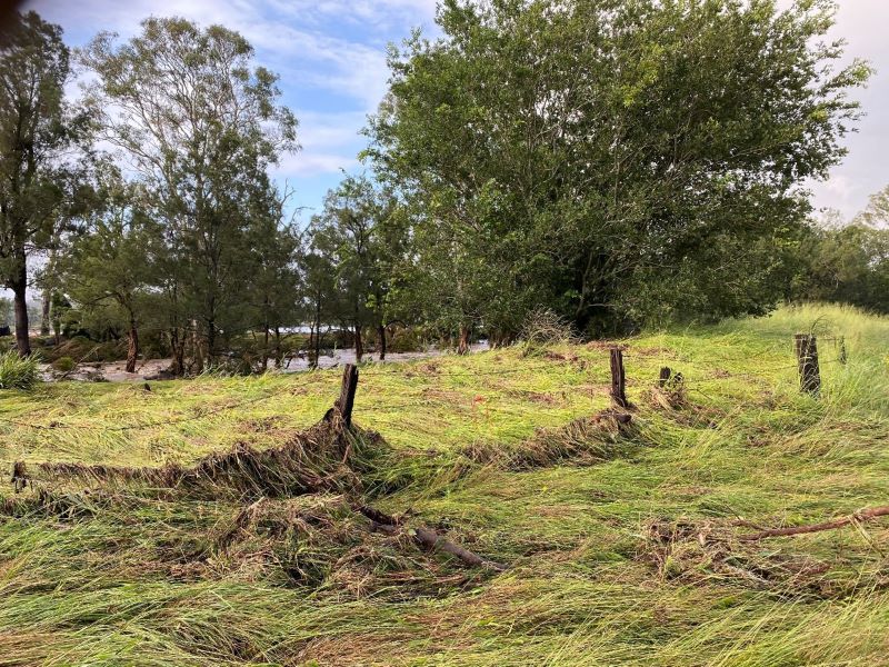 Flood-damaged fencing on farm property