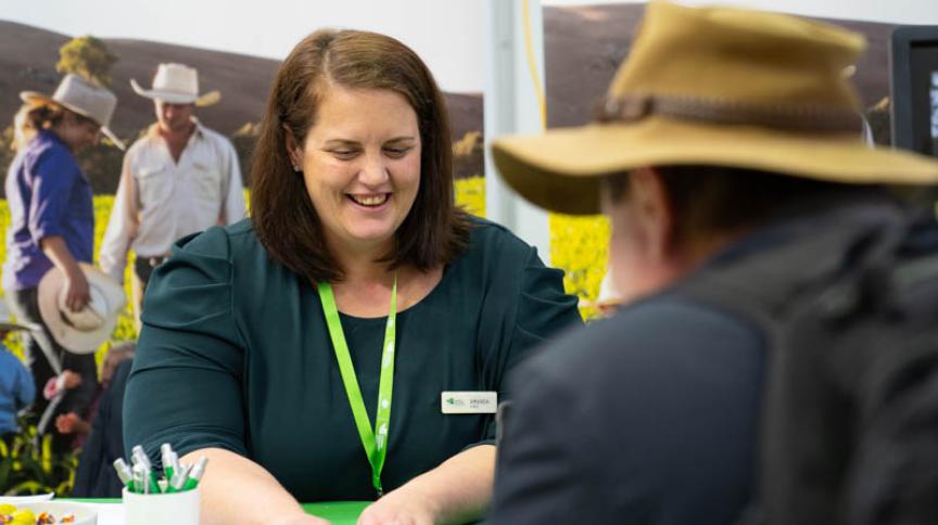 RIC employee serving farmer